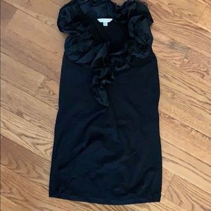 Cabi sleeveless with black ruffles around v neck